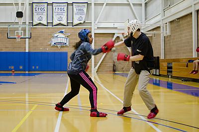 Landmark College students practicing boxing moves in fitness class