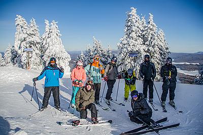 Landmark College skiers stop for a photo on mountain summit. 